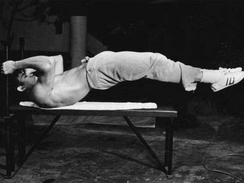 How to Do The Dragon Flag: Bruce Lee's Signature Ab Move - Old School Labs